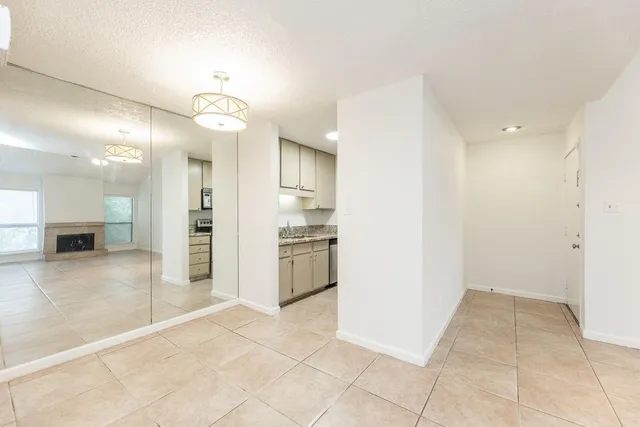 a kitchen with stainless steel appliances granite countertop a refrigerator stove and microwave