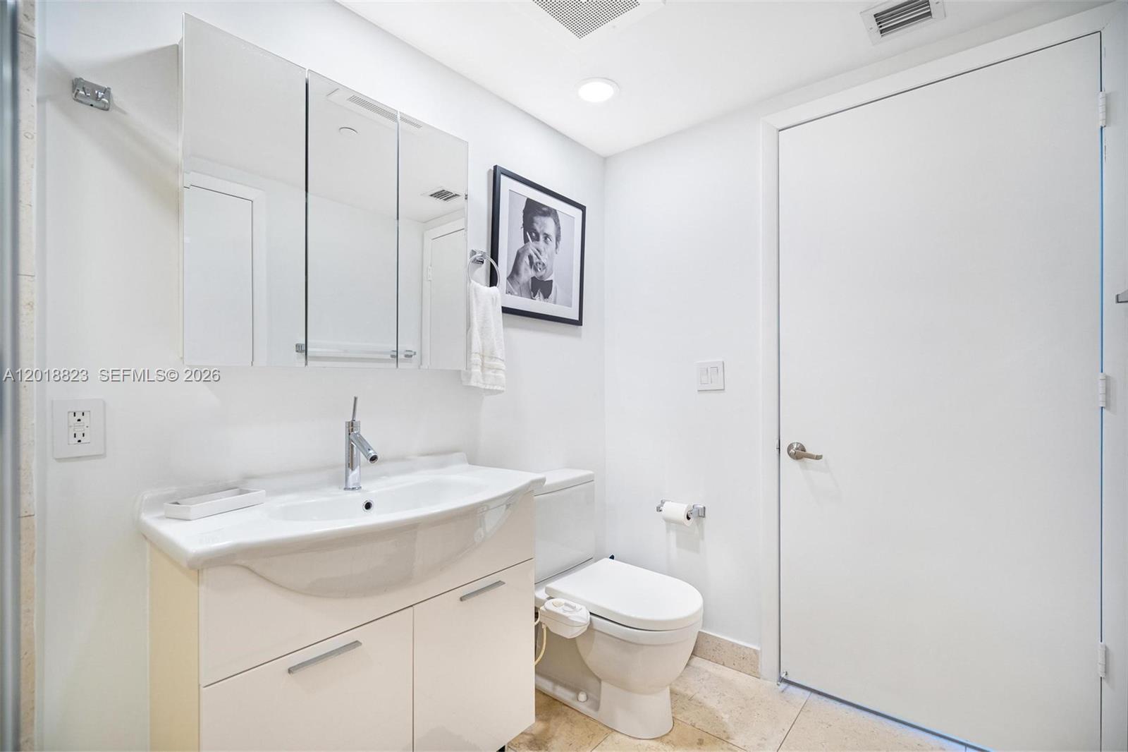 495 Brickell Avenue, Unit 4911 Miami, FL 33131 - Photo 32 of 35 a bathroom with a sink toilet and vanity