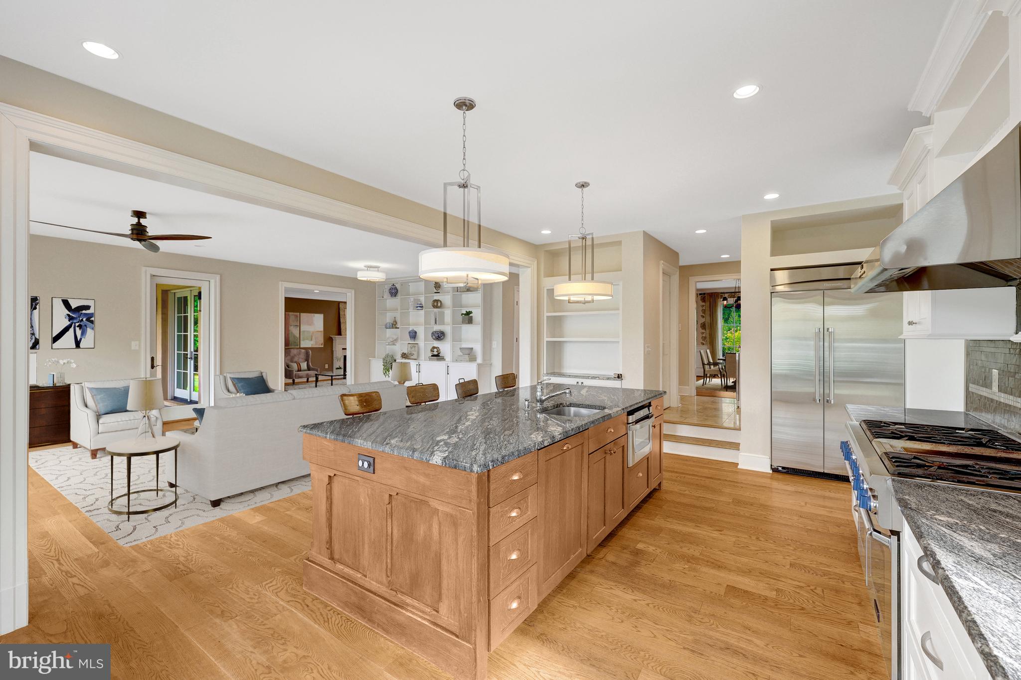 440 Montpelier Road Great Falls, VA 22066 - Photo 21 of 79 a large kitchen with kitchen island a large counter top stainless steel appliances and cabinets