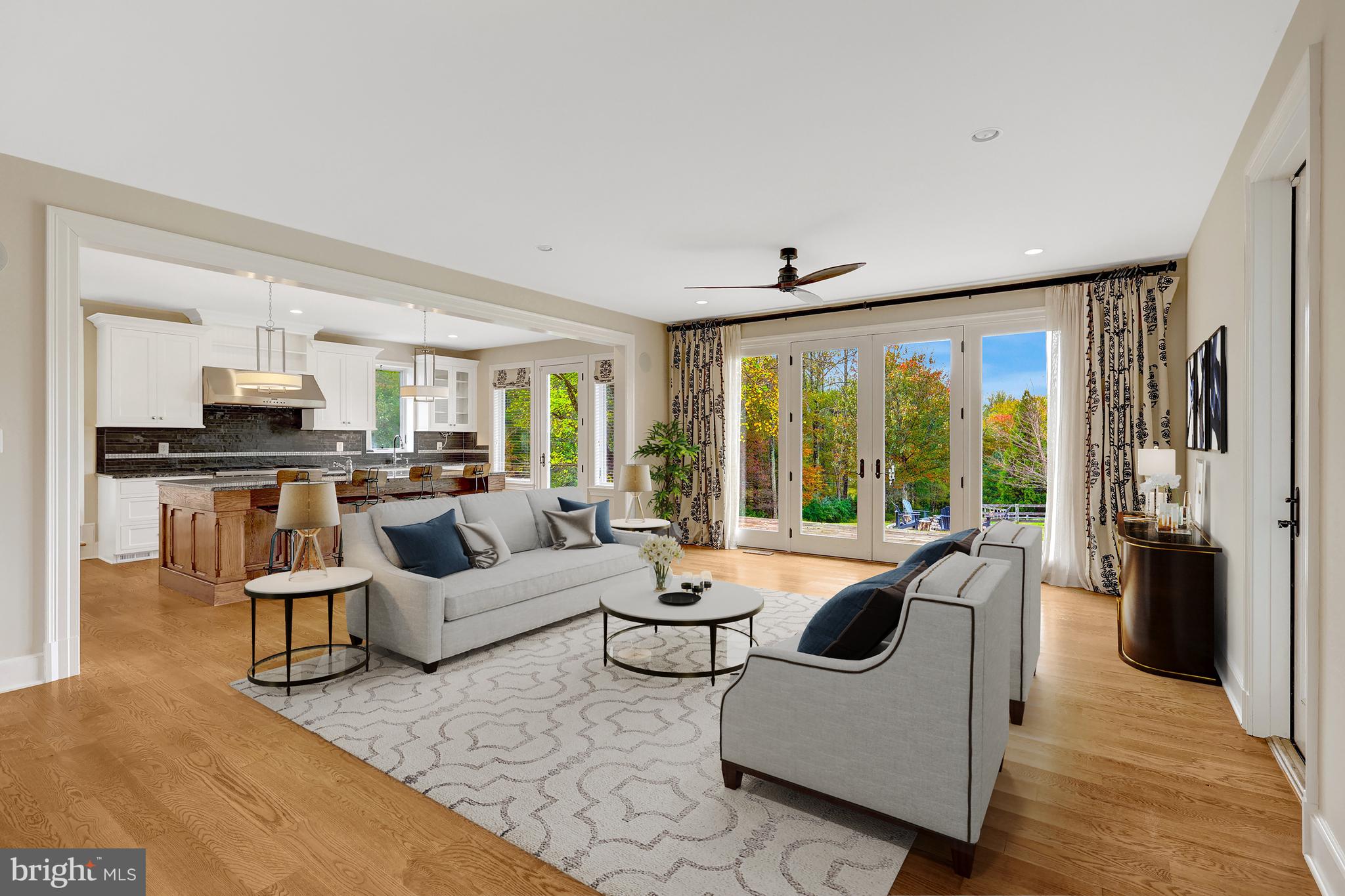 440 Montpelier Road Great Falls, VA 22066 - Photo 24 of 79 a living room with furniture and large windows