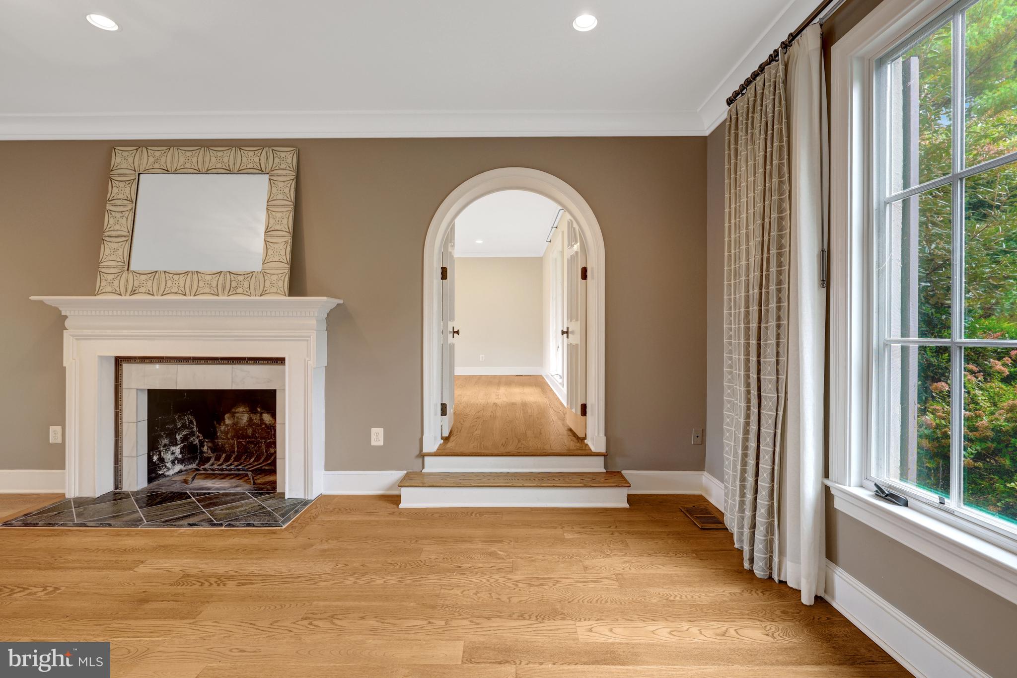 440 Montpelier Road Great Falls, VA 22066 - Photo 29 of 79 a view of a livingroom with a fireplace and window