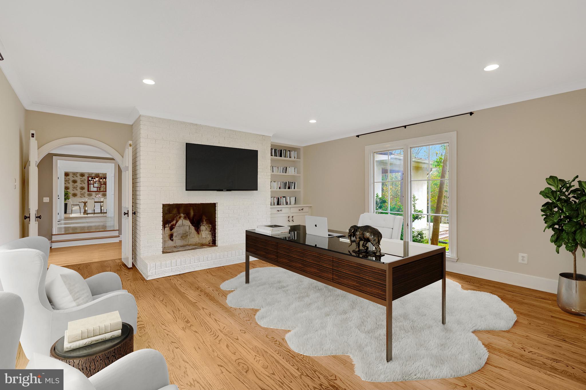440 Montpelier Road Great Falls, VA 22066 - Photo 30 of 79 a living room with furniture and a fireplace