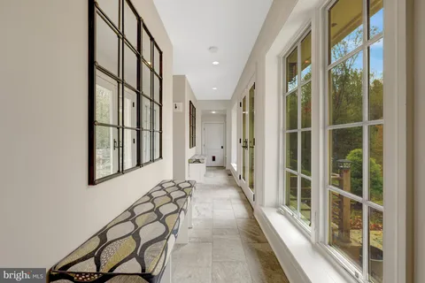 a spacious bathroom with a granite countertop sink mirror and