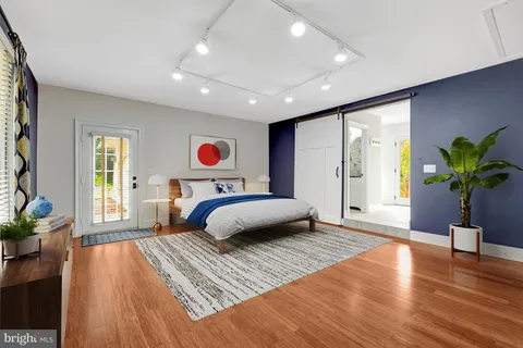 a bathroom with a sink a toilet a shower and a mirror