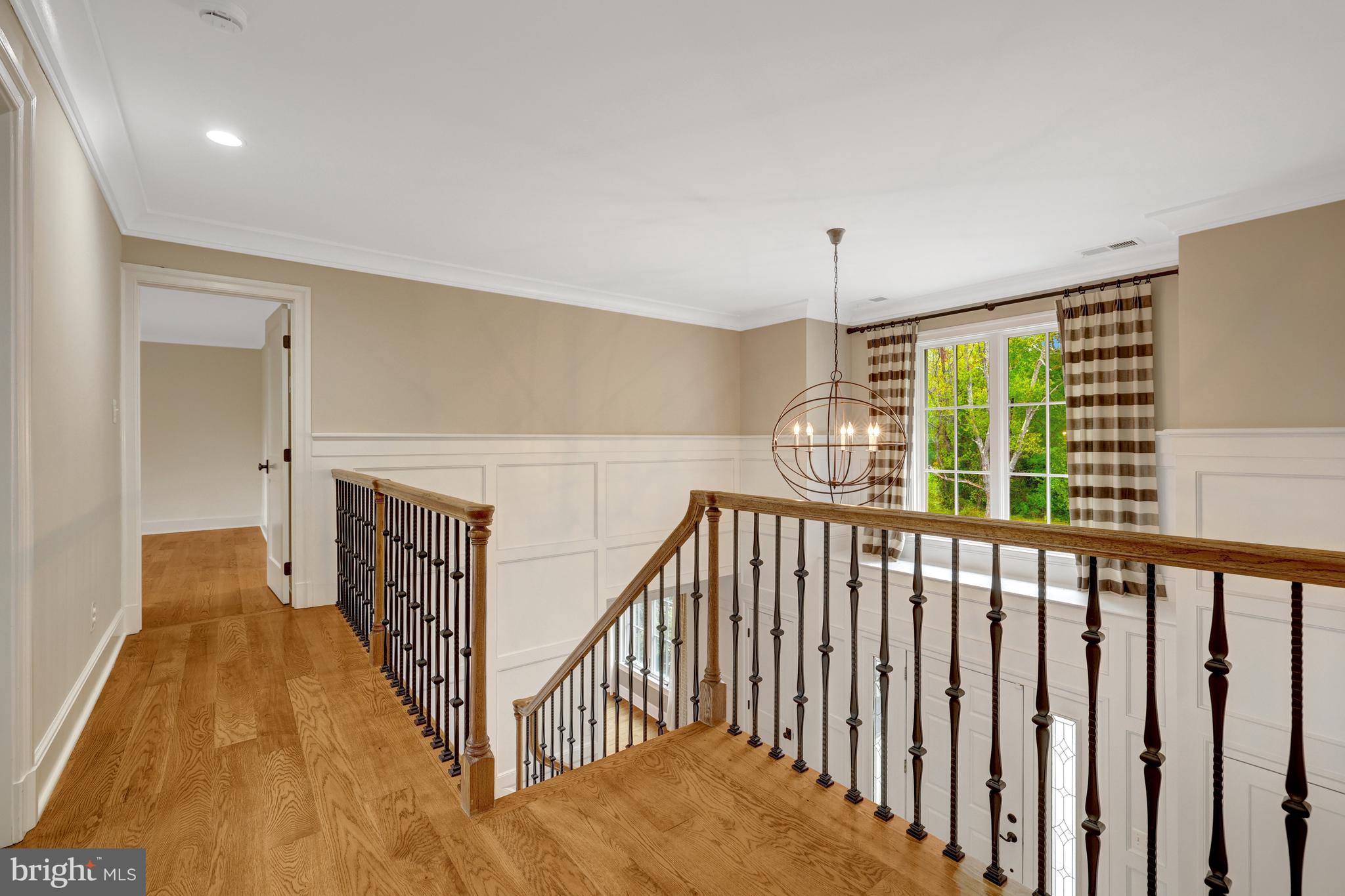 440 Montpelier Road Great Falls, VA 22066 - Photo 42 of 79 a view of a hallway with wooden floor and stairs