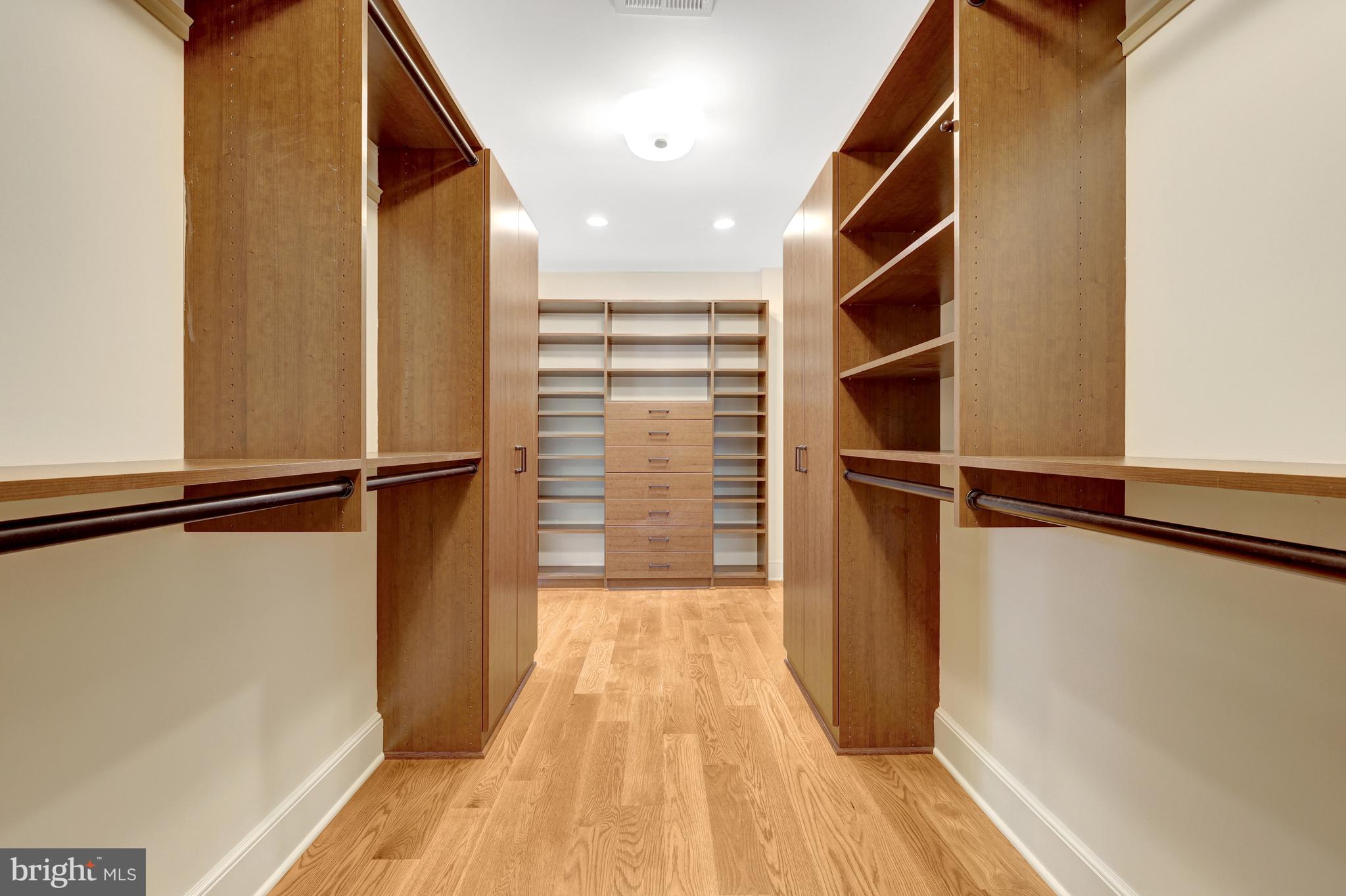 440 Montpelier Road Great Falls, VA 22066 - Photo 45 of 79 a view of walk in closet with clothes and shoes