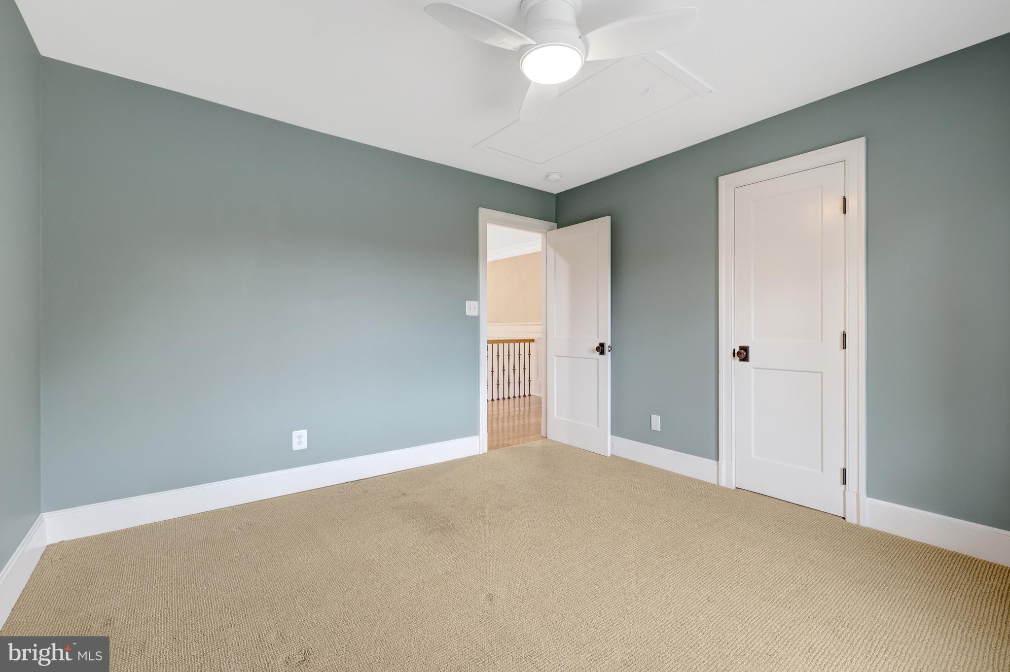 440 Montpelier Road Great Falls, VA 22066 - Photo 51 of 79 a view of an empty room with a chandelier fan