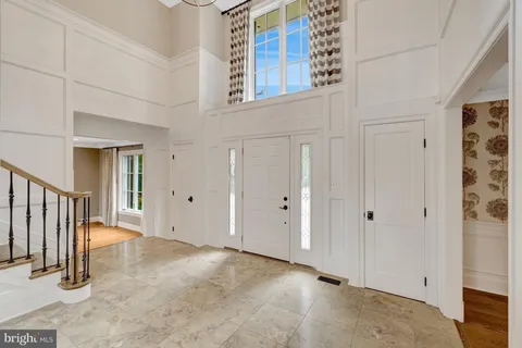 a view of a dining room with furniture and window