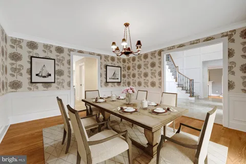 a large kitchen with a table and chairs in it