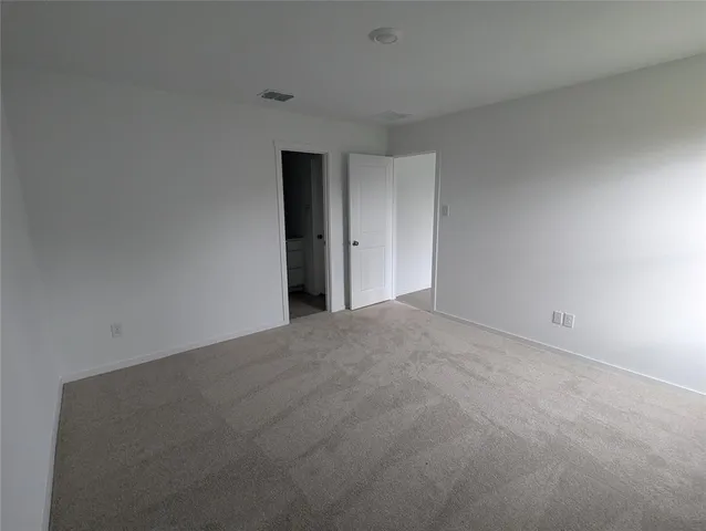 a bathroom with a toilet sink vanity and mirror