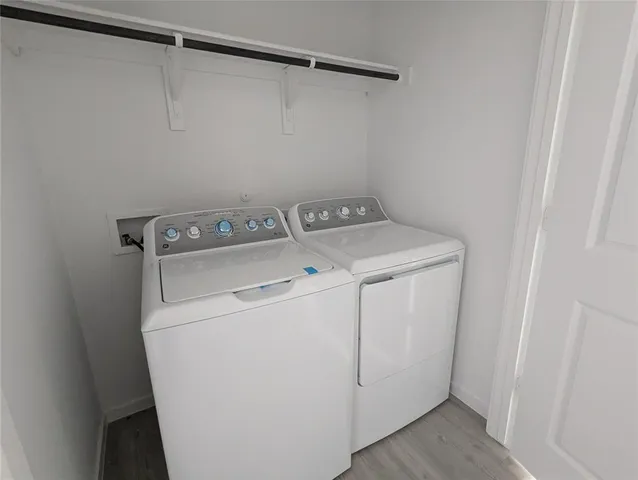 a kitchen with a refrigerator stove and cabinets