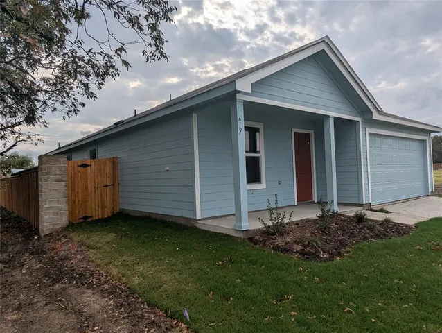 a view of a backyard with a garden