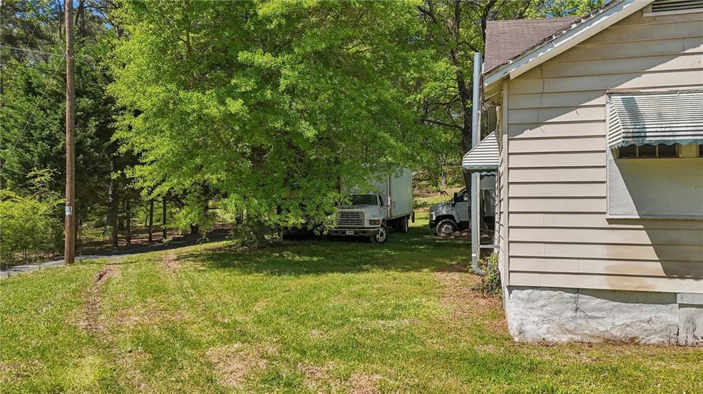 5735 Old Bill Cook Road Atlanta, GA 30349 - Photo 13 of 38 a view of a back yard of the house