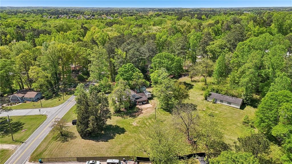 5735 Old Bill Cook Road Atlanta, GA 30349 - Photo 23 of 38 a view of a yard with plants