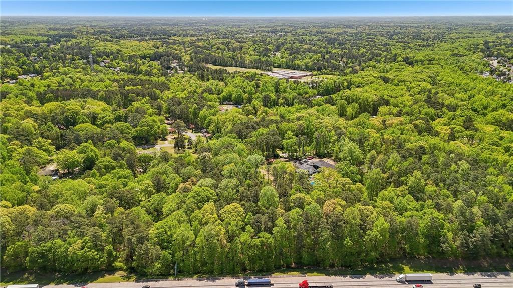 5735 Old Bill Cook Road Atlanta, GA 30349 - Photo 28 of 38 a view of a city with lush green forest