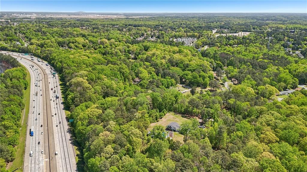5735 Old Bill Cook Road Atlanta, GA 30349 - Photo 30 of 38 a view of a city with lush green forest