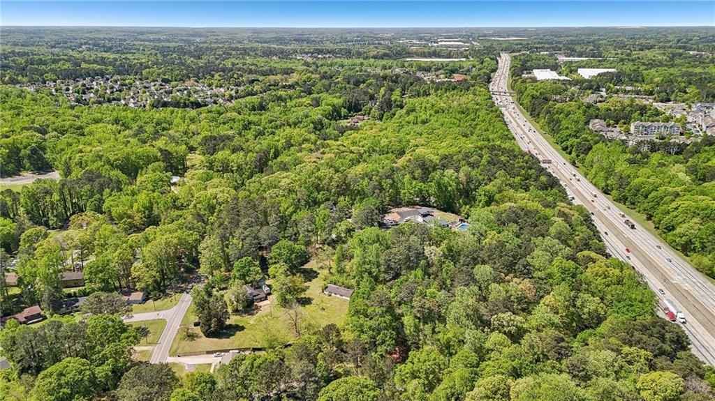 5735 Old Bill Cook Road Atlanta, GA 30349 - Photo 33 of 38 an aerial view of residential houses with outdoor space and trees