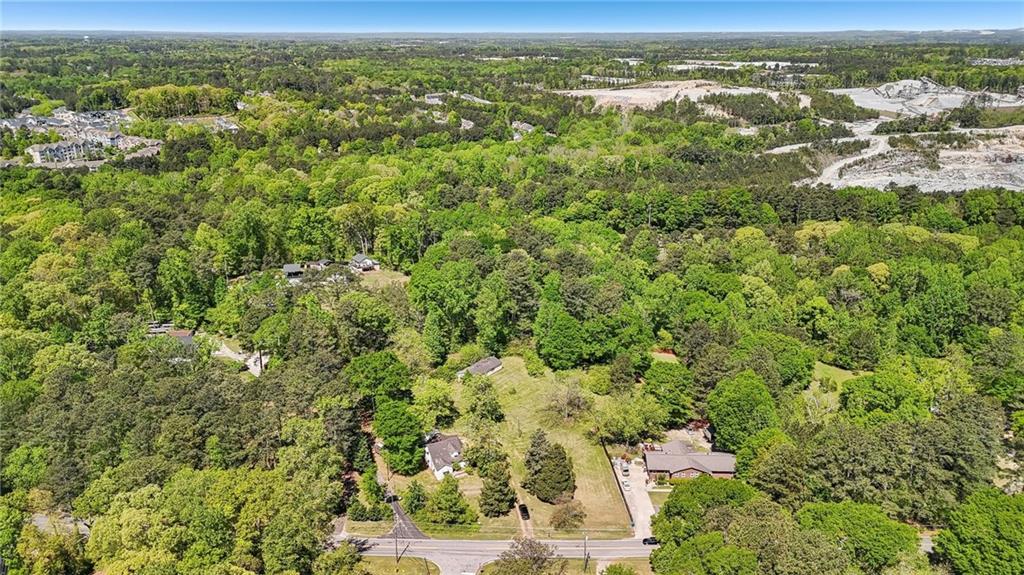 5735 Old Bill Cook Road Atlanta, GA 30349 - Photo 36 of 38 an aerial view of residential houses with outdoor space and trees