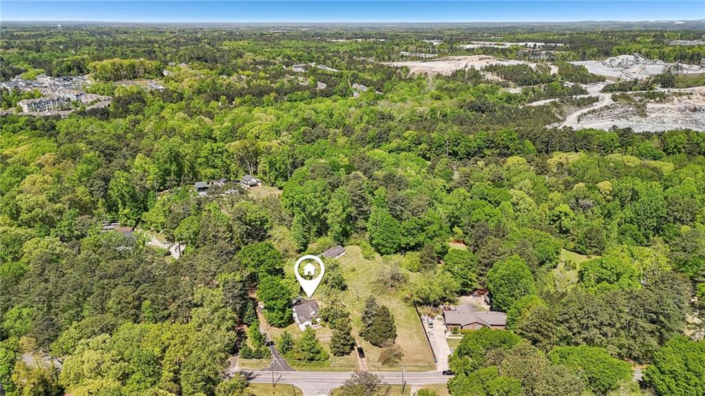 5735 Old Bill Cook Road Atlanta, GA 30349 - Photo 37 of 38 an aerial view of residential houses with outdoor space and trees