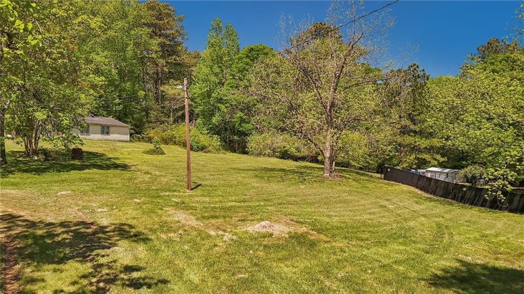 5735 Old Bill Cook Road Atlanta, GA 30349 - Photo 5 of 38 a view of a pool with an outdoor space