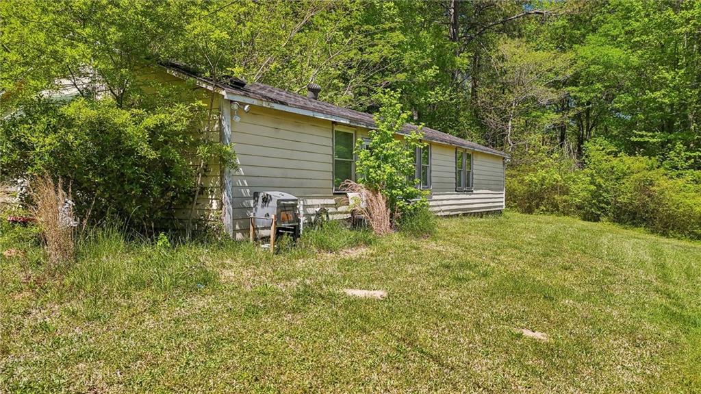 5735 Old Bill Cook Road Atlanta, GA 30349 - Photo 8 of 38 a backyard of a house with seating space