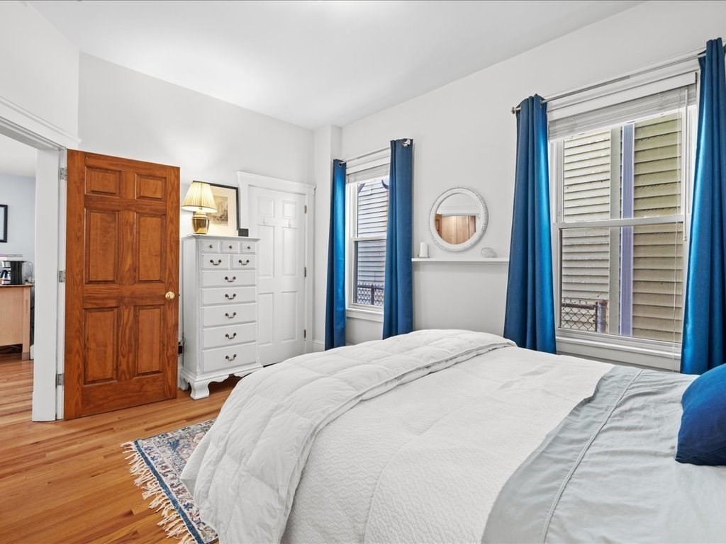 556 East 5th Street, Unit 1 Boston, MA 02127 - Photo 11 of 17 a bedroom with a bed and a closet