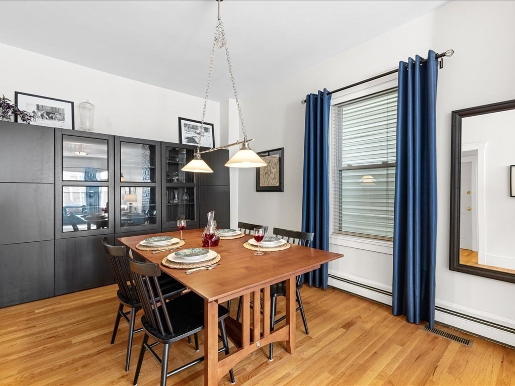 556 East 5th Street, Unit 1 Boston, MA 02127 - Photo 3 of 17 a dining room with furniture window and wooden floor