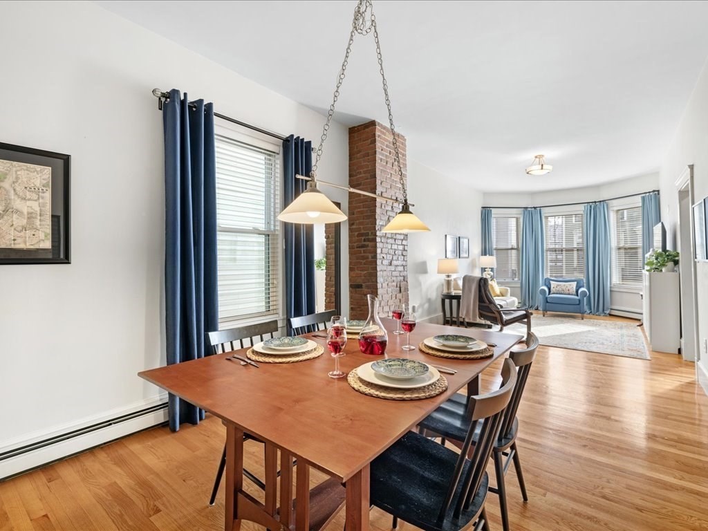 556 East 5th Street, Unit 1 Boston, MA 02127 - Photo 4 of 17 a dining room with furniture and wooden floor