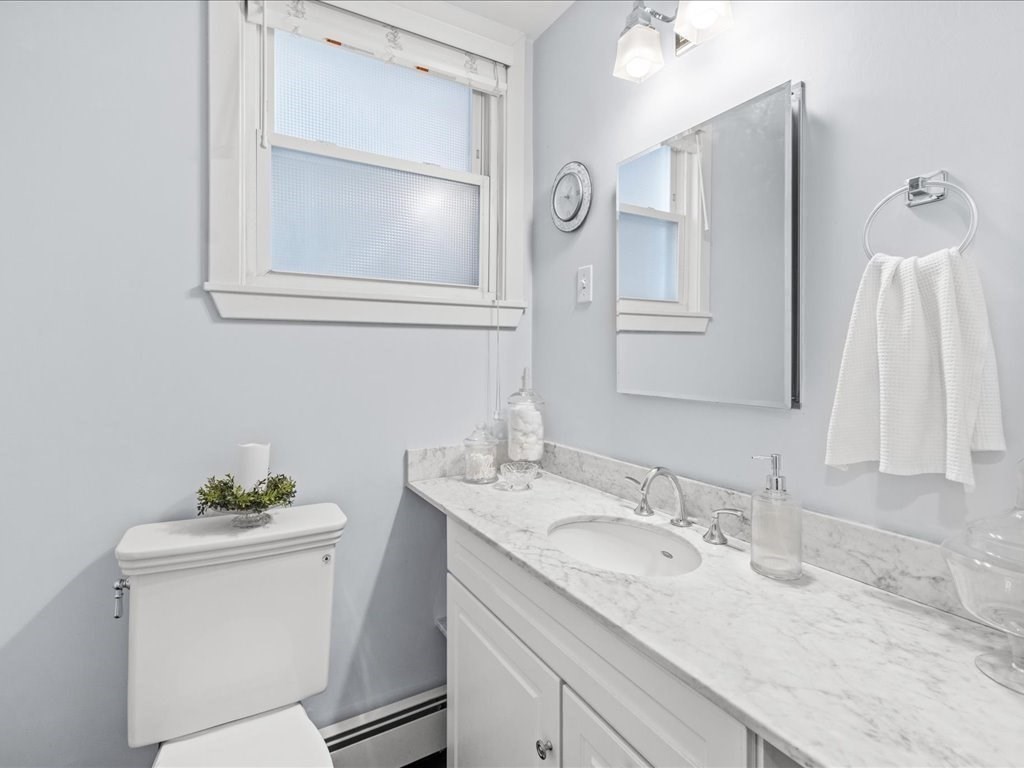 556 East 5th Street, Unit 1 Boston, MA 02127 - Photo 8 of 17 a bathroom with a sink vanity and a mirror