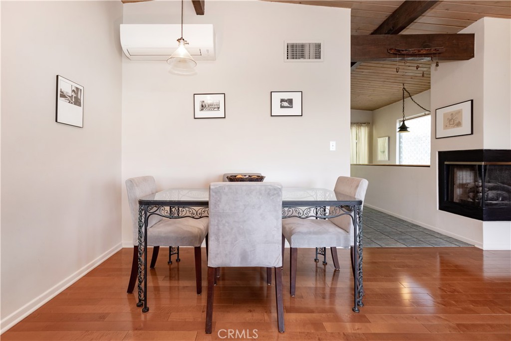 733 Crane Boulevard Los Angeles, CA 90065 - Photo 17 of 30 a view of a dining room with furniture and wooden floor