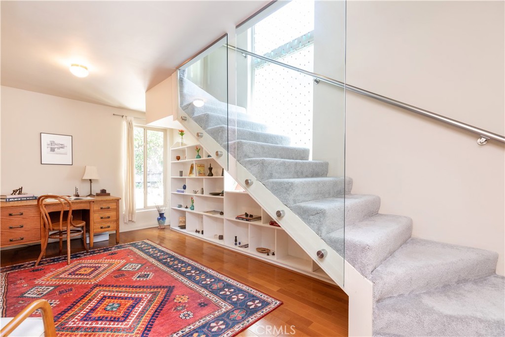 733 Crane Boulevard Los Angeles, CA 90065 - Photo 21 of 30 a living room with furniture and a rug