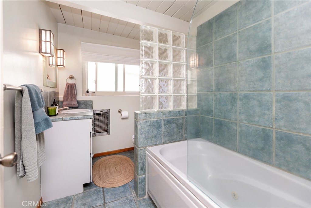 733 Crane Boulevard Los Angeles, CA 90065 - Photo 25 of 30 a bathroom with a tub and sink