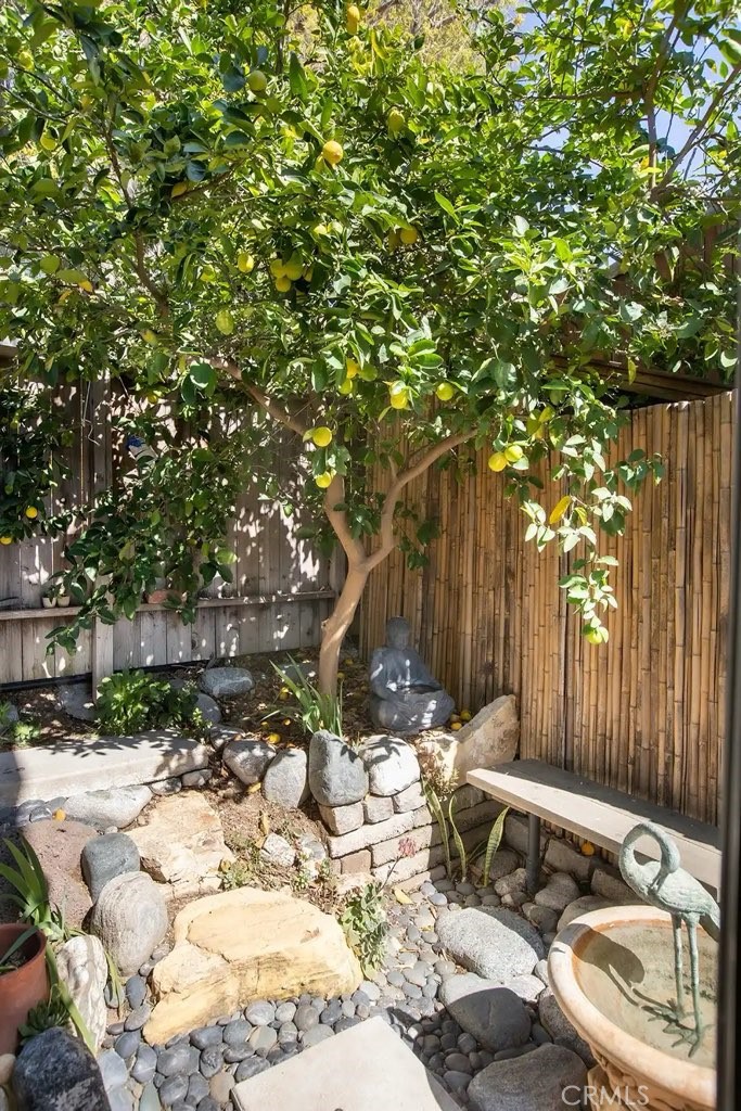 733 Crane Boulevard Los Angeles, CA 90065 - Photo 4 of 30 a view of backyard with a table and chairs and wooden fence