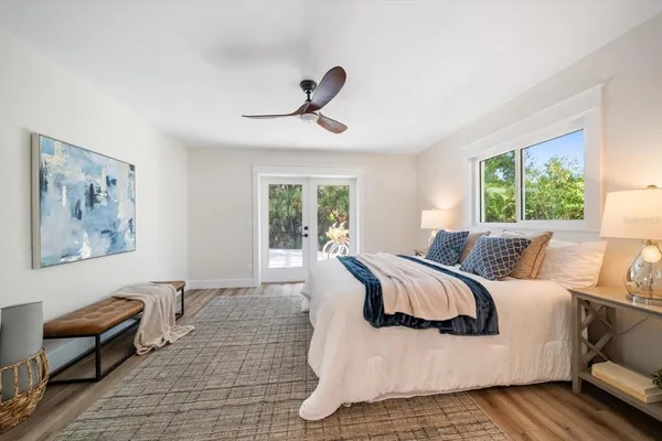 a bedroom with a large bed and a couch