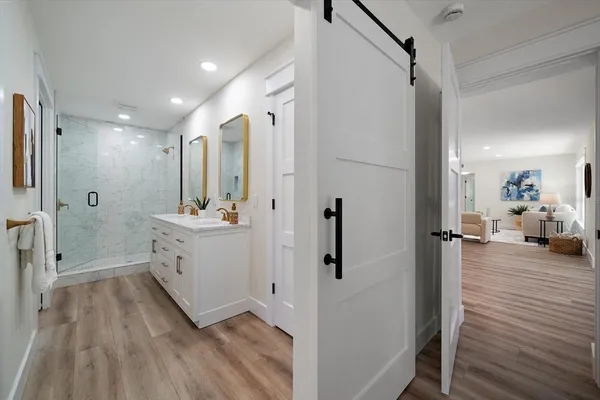 a bathroom with a double vanity sink and mirror