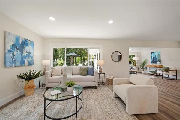 a living room with furniture and a large window