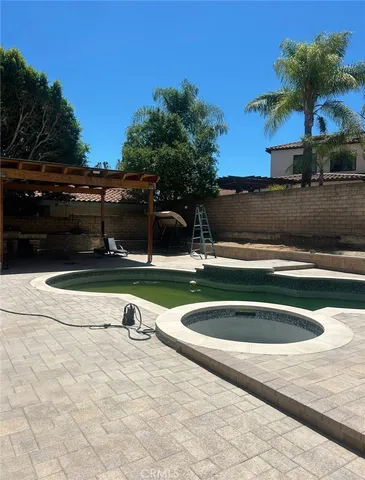 a view of swimming pool with outdoor seating
