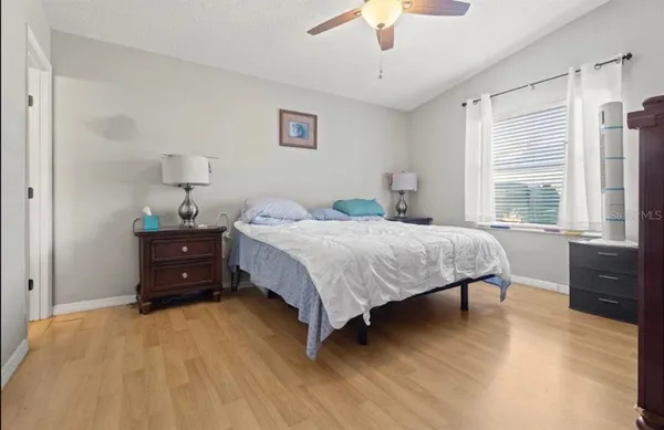 a bedroom with a bed and a dresser