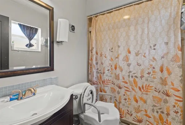 a bathroom with a sink toilet and vanity