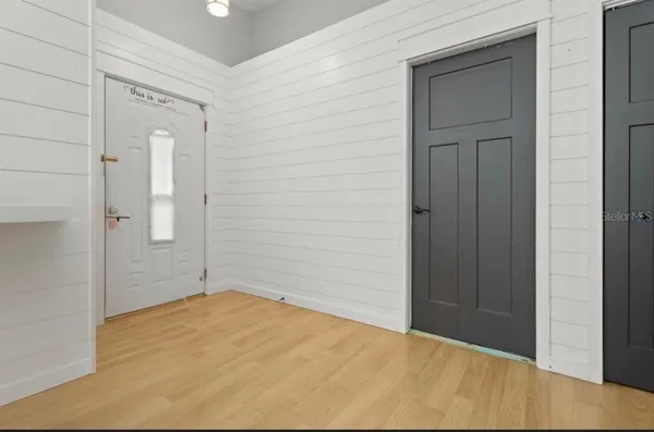 wooden floor and closet in a bathroom