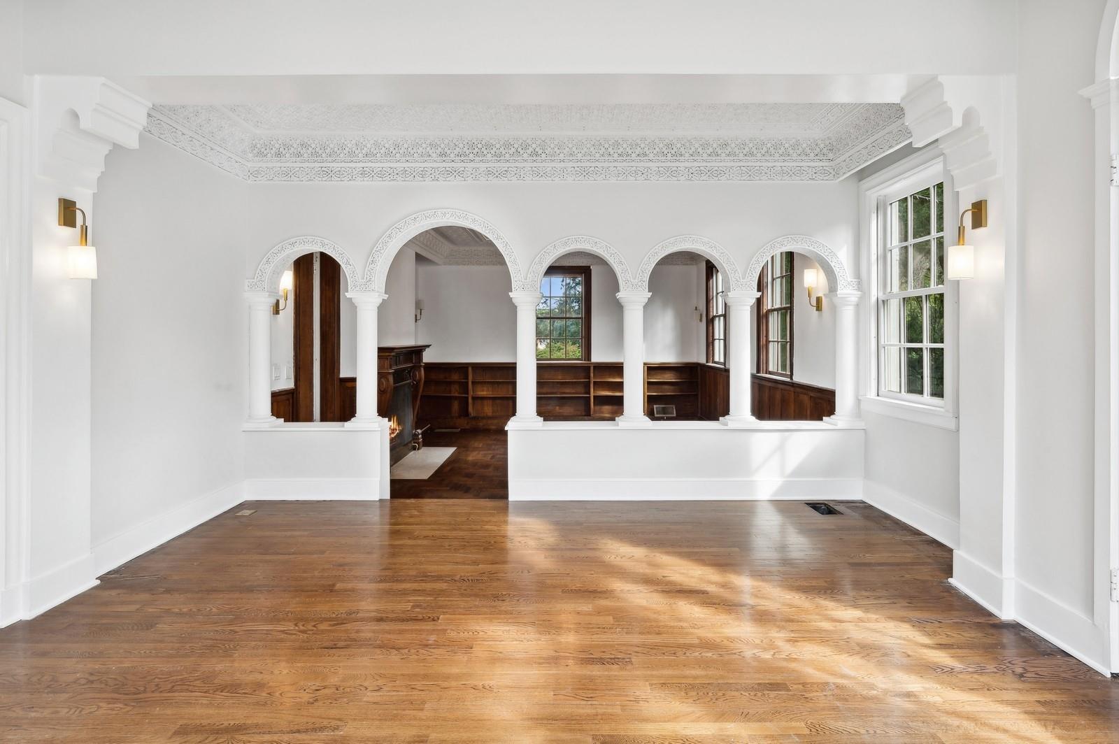 45 Durham Road Bronxville, NY 10708 - Photo 11 of 25 Unfurnished room with plenty of natural light, crown molding, and dark hardwood / wood-style floors