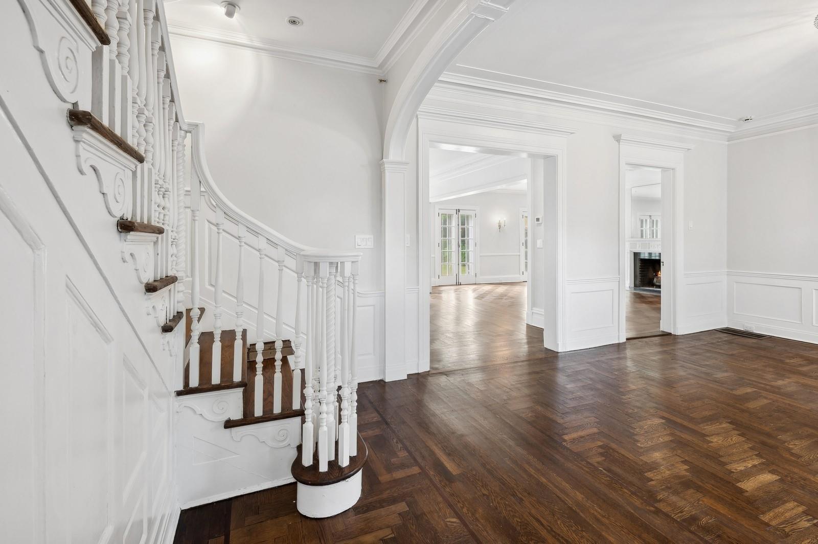 45 Durham Road Bronxville, NY 10708 - Photo 14 of 25 Entryway featuring crown molding and dark parquet floors