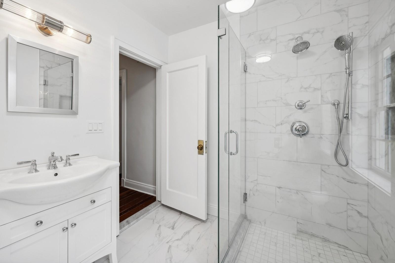 45 Durham Road Bronxville, NY 10708 - Photo 23 of 25 Bathroom featuring vanity and a shower with door