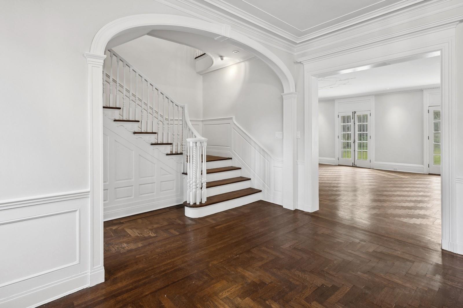 45 Durham Road Bronxville, NY 10708 - Photo 7 of 25 Staircase featuring parquet flooring and crown molding