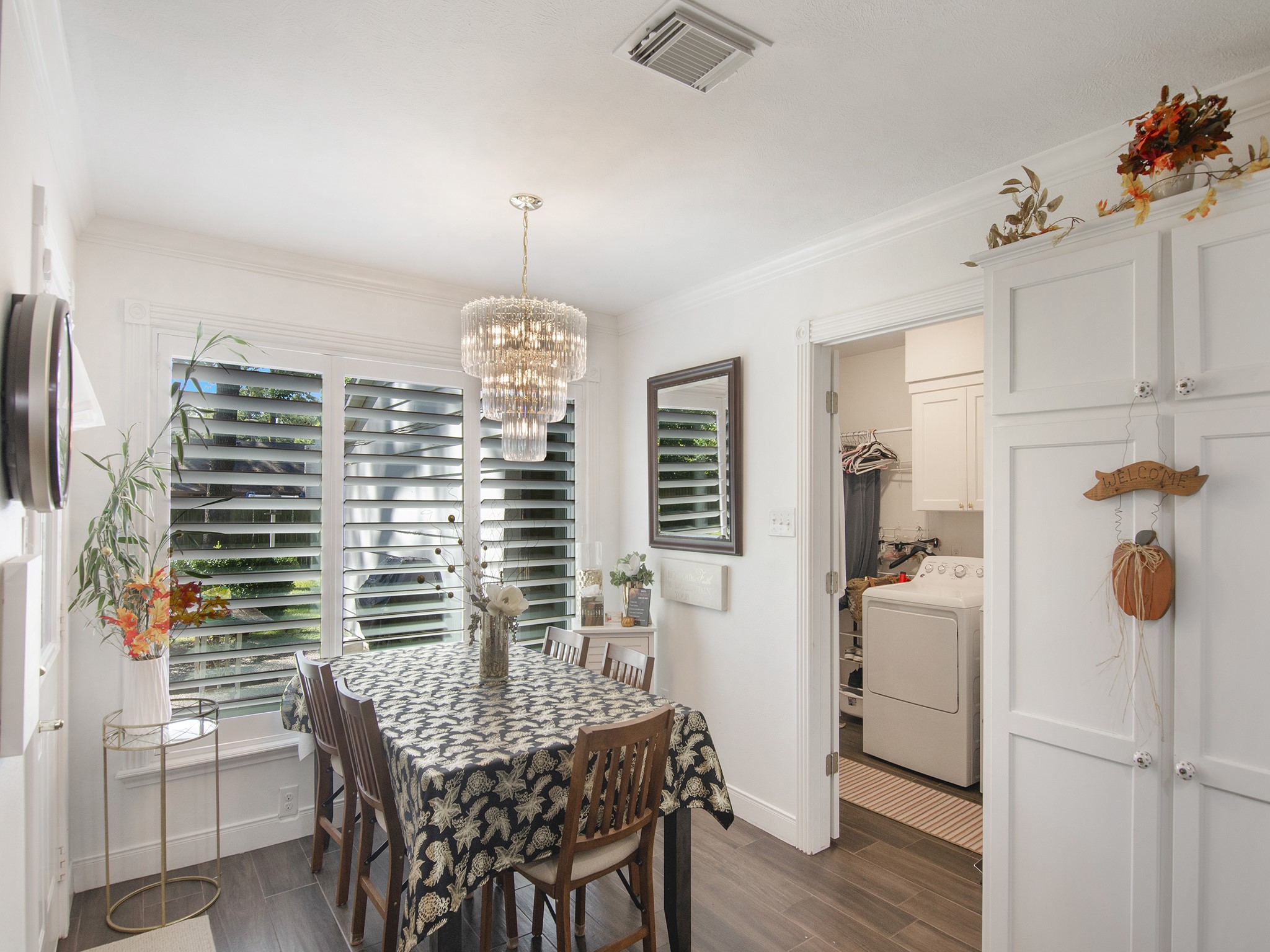 532 Raleigh Drive Conroe, TX 77302 - Photo 16 of 40 Adorable and cozy best describes this breakfast room bathed in natural light. A bright & cheeful room to enjoy casual meals and morning coffee. A few notable features are the beautiful chandelier, classic window shutters and it's conveniently located near the laundry room and half bathroom.