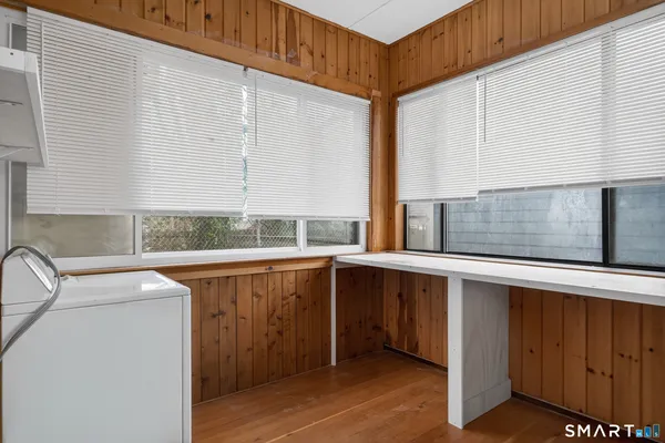 a view of a yard with wooden fence