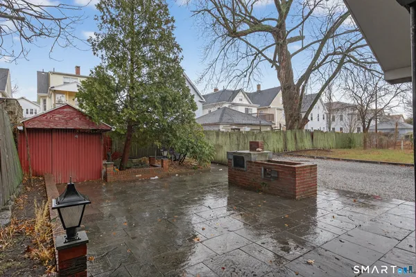 a car parked in front of a white house