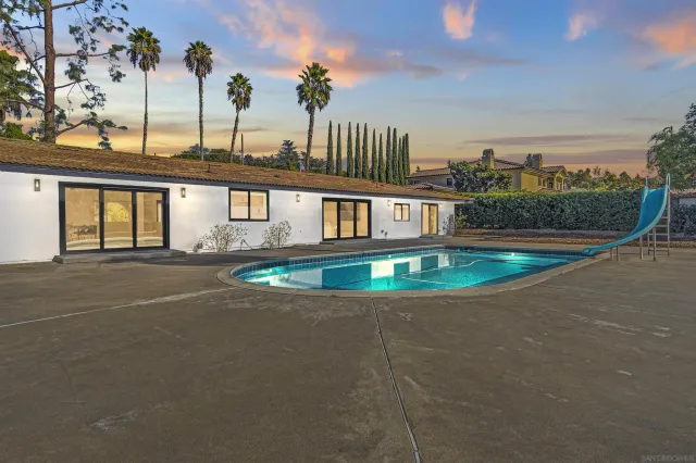 a view of a swimming pool with a lake view