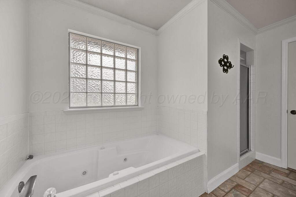 19933 Indian Spring Trail Bushland, TX 79124 - Photo 21 of 32 a bathroom with a bathtub