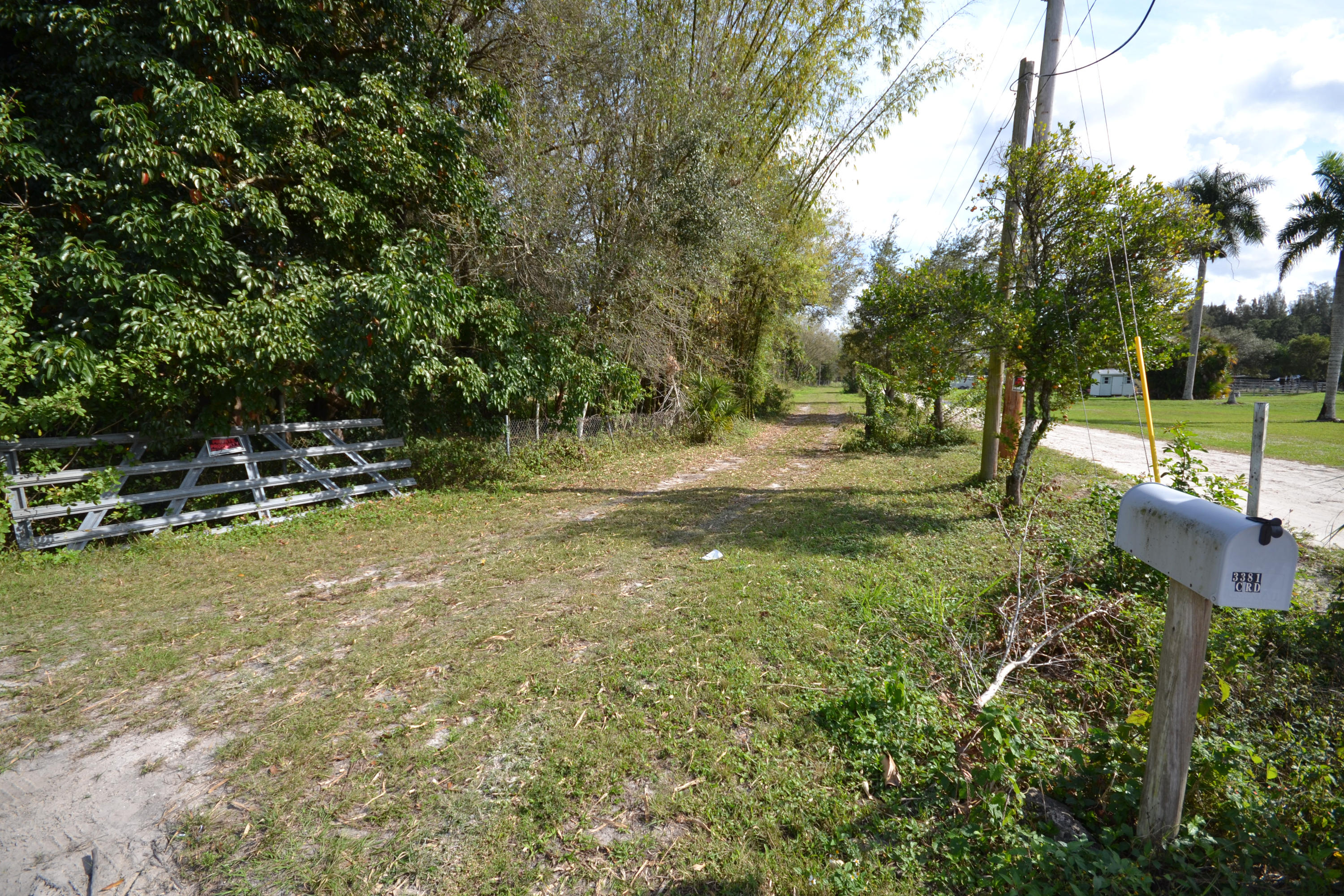 3320 C Road Loxahatchee, FL 33470 - Photo 1 of 15 a view of a park with swings and slides